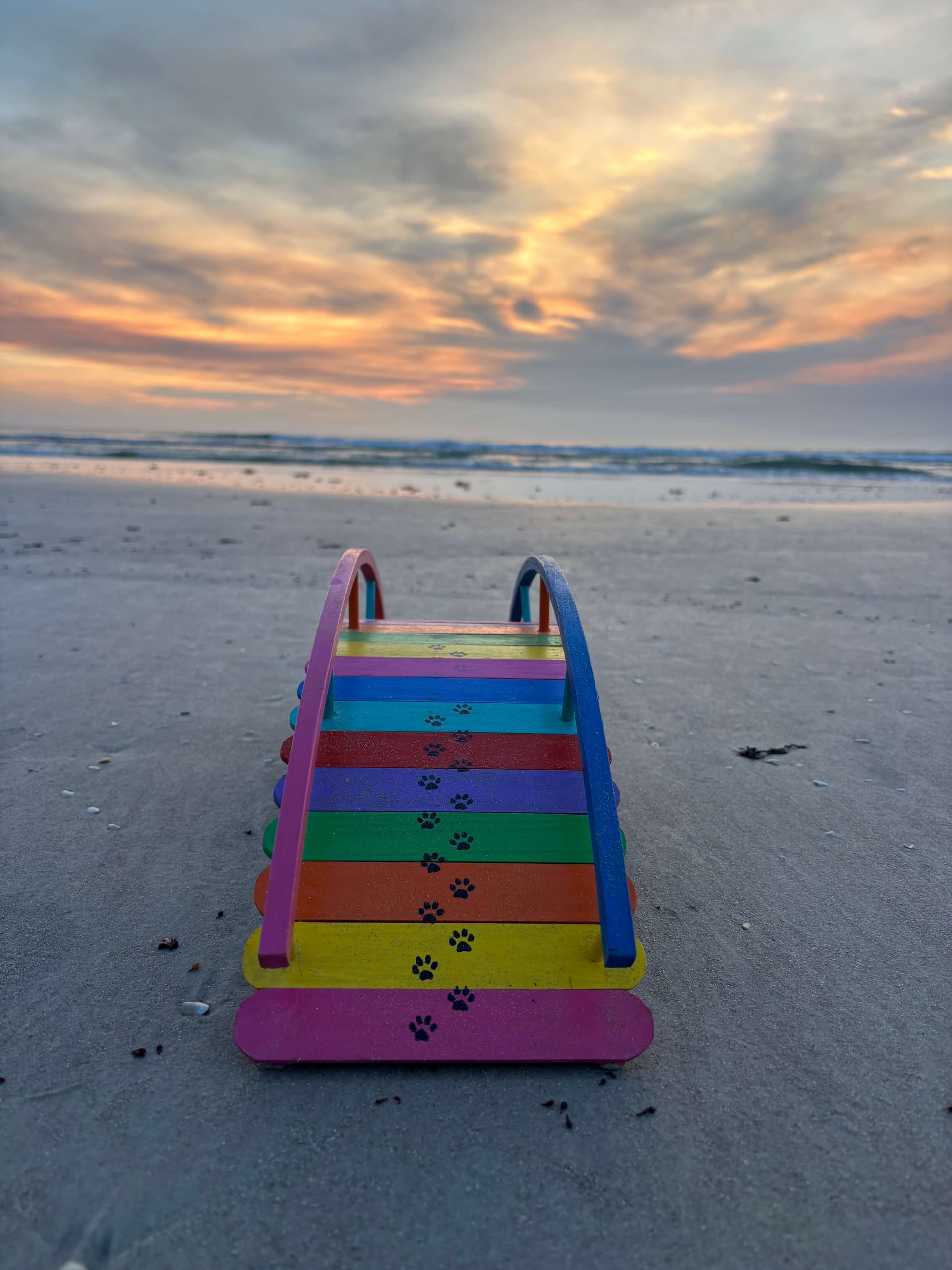 One of Paul Allabaugh's handmade rainbow bridges rising into the golden light at sunrise, just this side of heaven