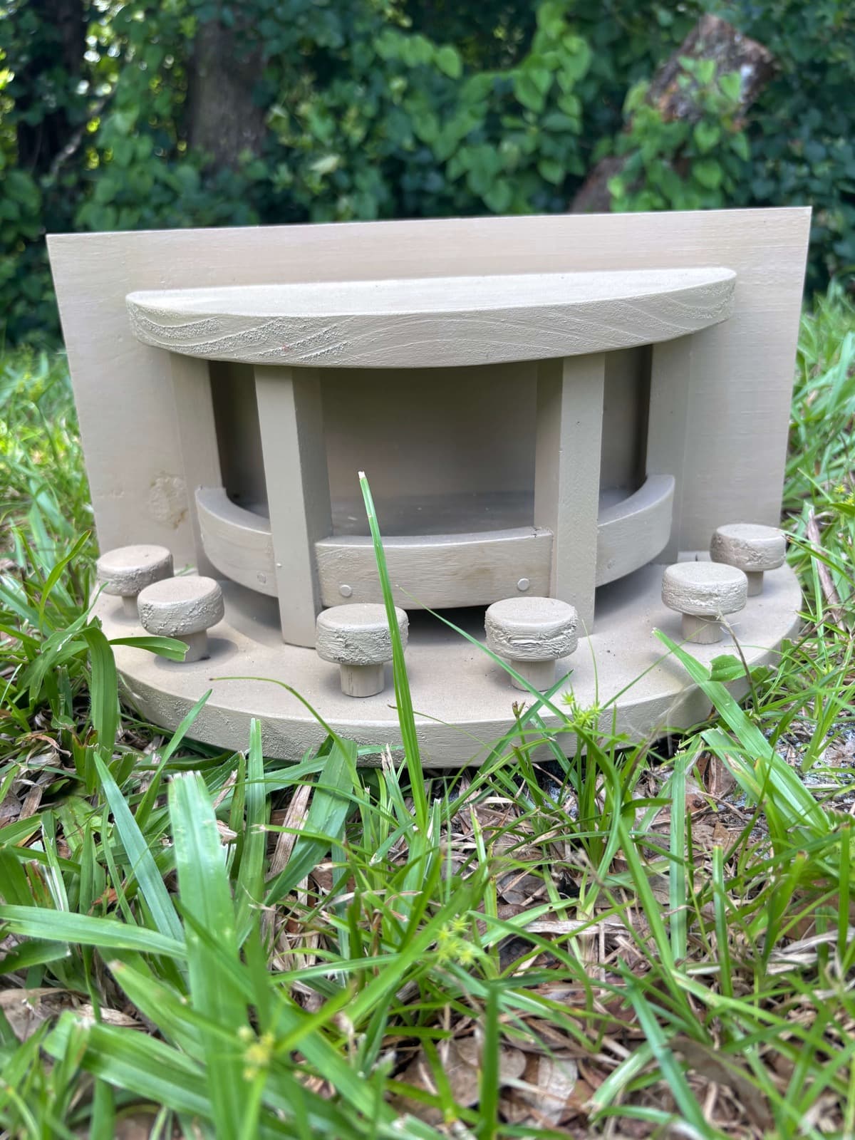 A grey handcrafted squirrel feeder by Paul Allabaugh