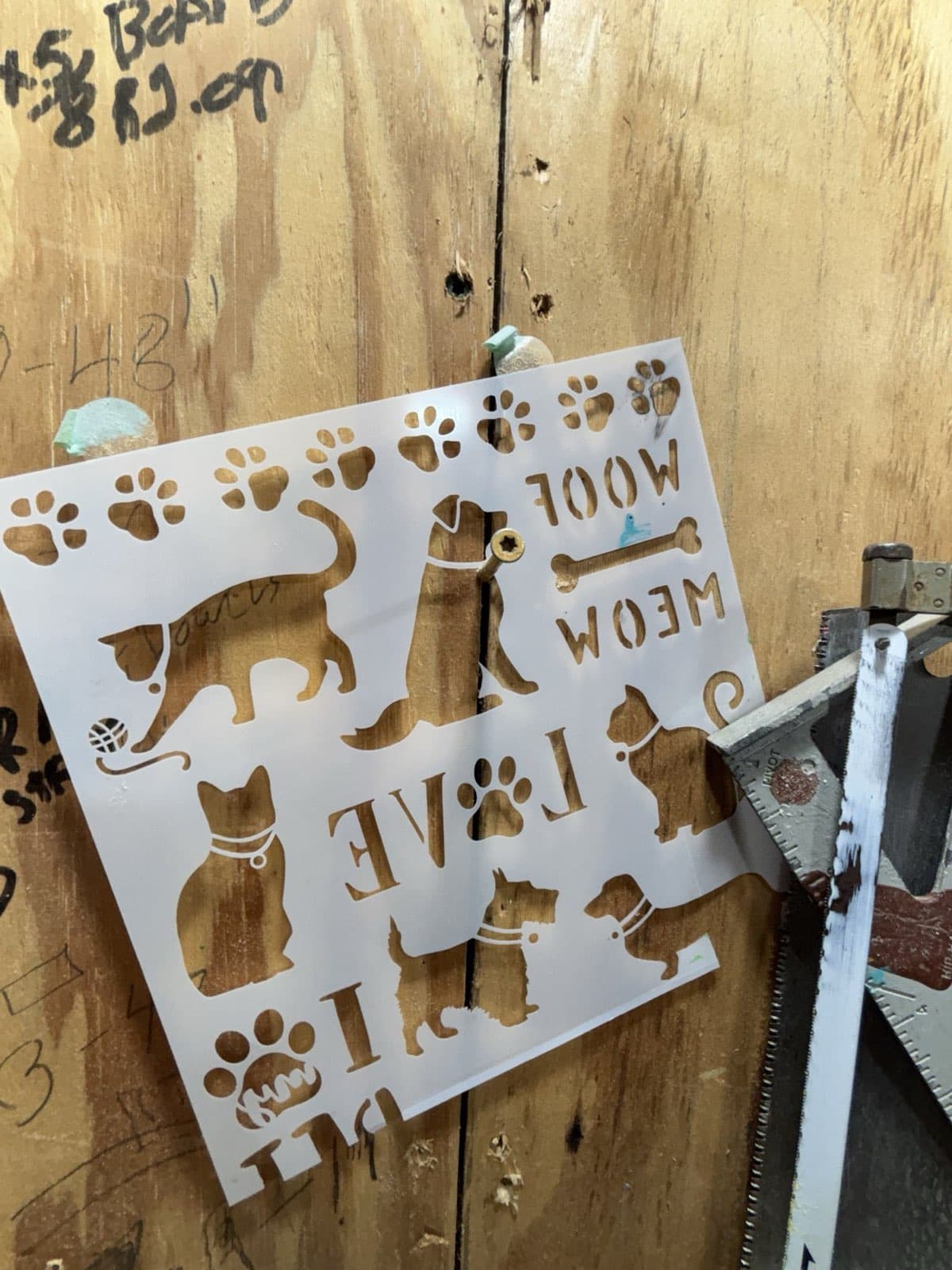 Pet stencils Paul Allabaugh kept on his workshop wall as patterns for the rainbow bridges he made for grieving pet owners